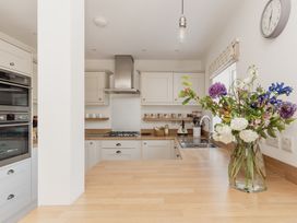 A kitchen with countertops and appliances at Tokenhill Cottage in Piddletrenthide