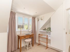 An office with a desk and chair at Tokenhill Cottage Piddletrenthide