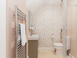 A bathroom with a sink and toilet at Tokenhill Cottage in Piddletrenthide