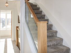 A staircase and hallway at 2 Channel View in Salcombe