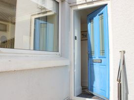 An entrance with a blue door and window at 2 Channel View Salcombe