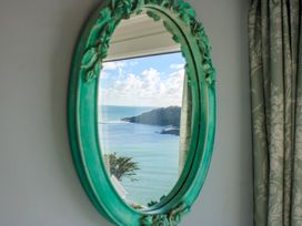A mirror reflecting the ocean view at 2 Channel View in Salcombe