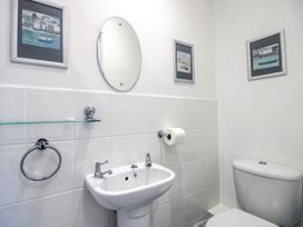 A bathroom with a sink and toilet at 2 Channel View in Salcombe