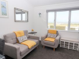 A living room with two sofas and a view of the outside at Bonny Bay in Wilsthorpe near Bridlington