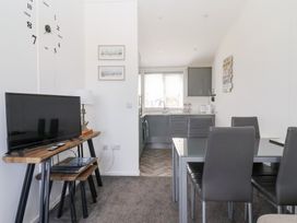 A dining area with a table and chairs at Bonny Bay in Wilsthorpe near Bridlington