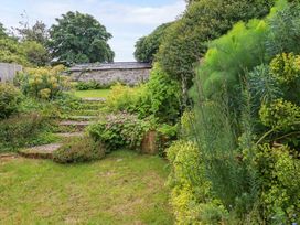 A garden with steps and plants at Clematis House in St Columb Major