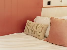 A bedroom with pillows on a bed at Spindleberry Hut in Piddletrenthide