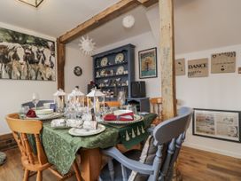 A dining room with a decorated table at The Old Byre in Woodfalls