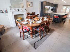 A dining room with a table set for breakfast at Cavan Cottage Yoxford