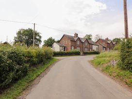 A view of houses along a road at Rose Bank Cottage in Dalston
