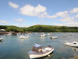 A harbor with boats on water at 3 River View in Looe