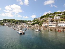 A waterfront with boats and houses at 3 River View Looe