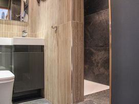 A bathroom with a toilet and sink at 5 Harbour Yard in Salcombe