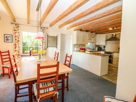 A dining room with a table and chairs at Whispering Pines in Durrus, County Cork
