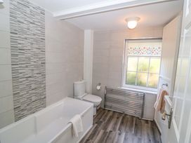 A bathroom with a bathtub and toilet at Whispering Pines in Durrus, County Cork