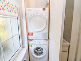 A washing machine and dryer in a laundry room at Whispering Pines, Durrus, County Cork