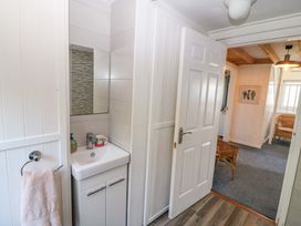 A bathroom with a sink and mirror at Whispering Pines in Durrus, County Cork