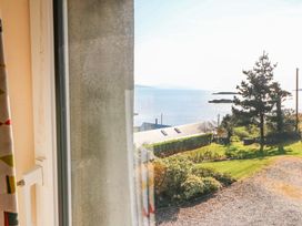A view of the sea and landscape from a window at Whispering Pines in Durrus, County Cork