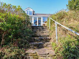 Steps leading to a house surrounded by plants at Whispering Pines, Durrus, County Cork
