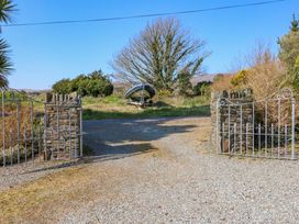 An outdoor image showing gates and a boat at Whispering Pines in Durrus, County Cork