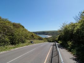 A view of a road leading down to the sea at Honeysuckle Lodge Runswick Bay near Staithes