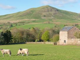 A field with sheep and a barn beside a hill at Shepherds View, Dufton, near Appleby-in-Westmorland