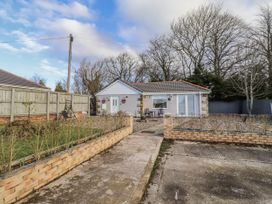 A house with a pathway and fencing at Old Colliery Cottage Shilbottle