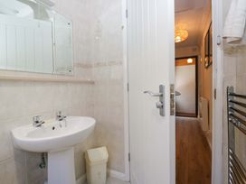 A bathroom with a sink and toilet at Beech Timber Lodge in Keswick