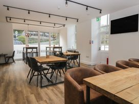 A cafe with tables and chairs at Elm Lodge in Keswick