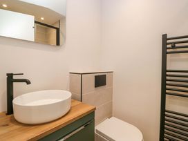 A bathroom with a sink and toilet at Riverside Cottage No 5 in Keswick