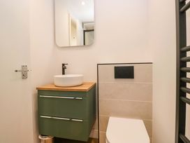 A bathroom with a sink and toilet at Riverside Cottage No 5 in Keswick