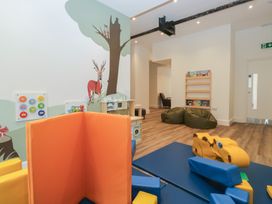 A playroom with toys and a mural at Pod No 5 in Keswick