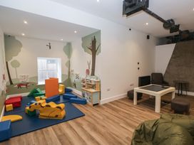 A playroom with foam blocks and a table at Briery House in Keswick