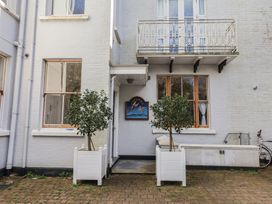 An outdoor area with planters and a bicycle at 2 St Michaels House in Lyme Regis