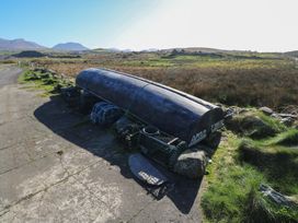 A boat and fishing nets beside a road at Sea View House in Tully, County Galway