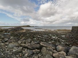 A rocky shore next to the sea at Sea View House in Tully, County Galway