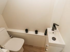 A bathroom with toilet and sink at Millside View 