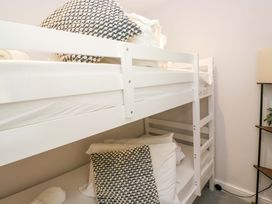 A bunk bed with pillows and towels at Riverside Cottage No 4 in Keswick
