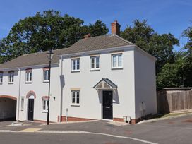 A house with windows and a door at 22 Applebee Way Lyme Regis