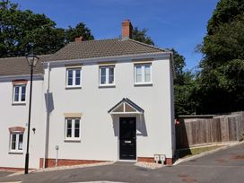 A house with windows and a door at 22 Applebee Way in Lyme Regis