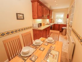 A dining room with a table set for a meal at Flat 17 in Keswick