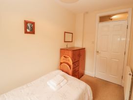 A bedroom with a bed and a chest of drawers at Flat 17 in Keswick