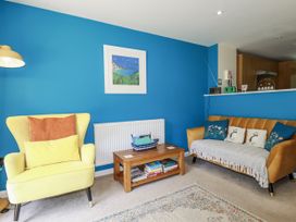 A living room with seating and a coffee table at 64 St Columb Road