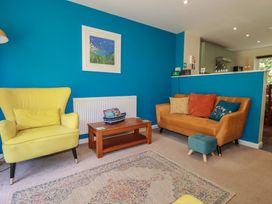 A living room with a sofa and armchair at 64 St Columb Nr Newquay