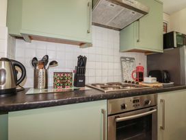 A kitchen with various appliances and utensils at 64 St Columb Nr Newquay