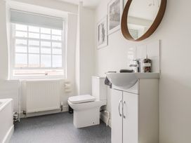 A bathroom with a sink and toilet at Jasper in Lyme Regis