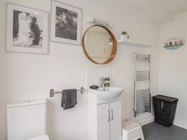 A bathroom with toilet and sink at Jasper in Lyme Regis