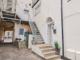 An outdoor area with stairs and door at Jasper in Lyme Regis
