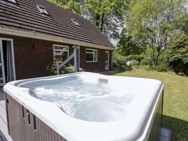A hot tub in a garden at Woodlands Retreat Llanfwrog near Ruthin