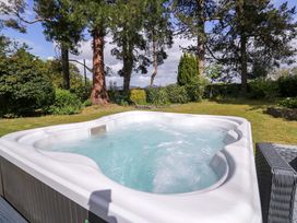 A hot tub in a garden at Woodlands Retreat Llanfwrog near Ruthin